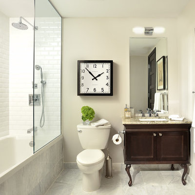 Example of a classic white tile and subway tile bathroom design in Toronto with an undermount sink, furniture-like cabinets, dark wood cabinets, a two-piece toilet and white walls