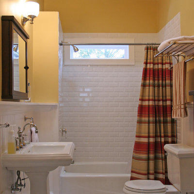 Inspiration for a timeless white tile and subway tile multicolored floor bathroom remodel in Atlanta with a pedestal sink and yellow walls