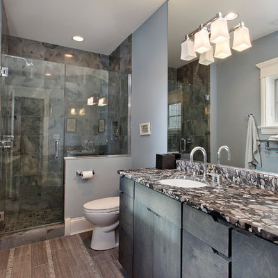 Example of a classic gray tile alcove shower design in Chicago with an undermount sink, flat-panel cabinets and blue cabinets