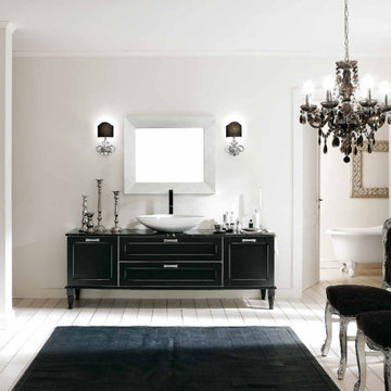 Traditional bathroom with black distressed vanity with black top