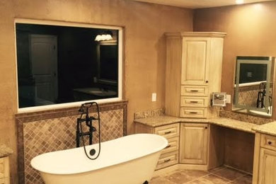 Bathroom - traditional master brown tile and ceramic tile ceramic tile and brown floor bathroom idea in San Francisco with raised-panel cabinets, light wood cabinets, brown walls, an undermount sink, granite countertops and a hinged shower door