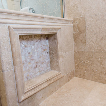 Traditional master bath with travertine