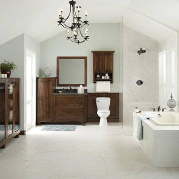 Traditional-Modern bathroom with accented dark cabinetry, marble flooring, glass