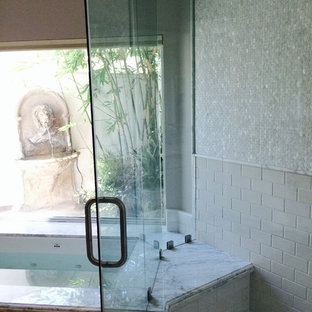 Inspiration for a timeless master white tile and subway tile travertine floor corner shower remodel in Other with marble countertops, an undermount tub and gray walls