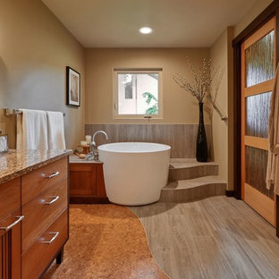 Photo of a large asian master bathroom in Portland with a japanese tub, multi-coloured tile, ceramic tile, cork floors, an undermount sink and engineered quartz benchtops.