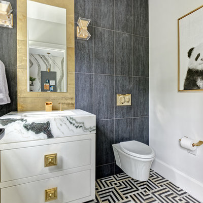 Bathroom - mid-sized transitional 3/4 black tile, gray tile and porcelain tile mosaic tile floor and multicolored floor bathroom idea in New York with furniture-like cabinets, white cabinets, a wall-mount toilet, white walls, an undermount sink, marble countertops and white countertops