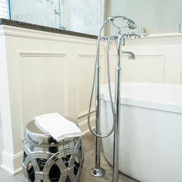 Transitional bath with freestanding tub and chrome floor mounted tub filler