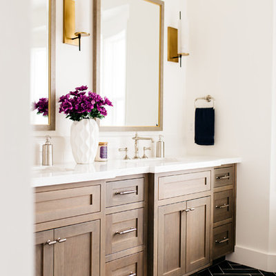 Inspiration for a large transitional master black floor and porcelain tile freestanding bathtub remodel in San Diego with shaker cabinets, dark wood cabinets, white walls, an undermount sink and quartz countertops