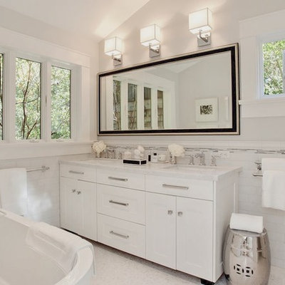 Transitional white tile and subway tile freestanding bathtub photo in San Francisco with an undermount sink, white cabinets, marble countertops and shaker cabinets
