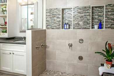 Mid-sized eclectic master beige tile and porcelain tile porcelain tile bathroom photo in Philadelphia with shaker cabinets, white cabinets, a two-piece toilet, green walls, an undermount sink and marble countertops