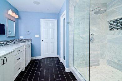 Inspiration for a large transitional master white tile and stone tile porcelain tile double shower remodel in Chicago with an undermount sink, recessed-panel cabinets, white cabinets, marble countertops, a two-piece toilet and blue walls