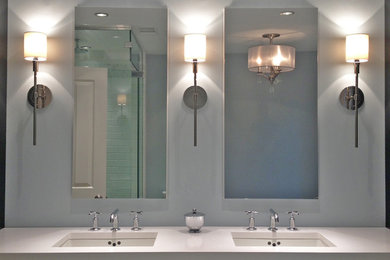 Mid-sized transitional master gray tile and stone tile marble floor bathroom photo in Chicago with an undermount sink, furniture-like cabinets, dark wood cabinets, quartzite countertops, a one-piece toilet and blue walls