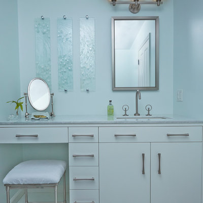 Inspiration for a mid-sized transitional blue tile and glass tile bathroom remodel in New York with an undermount sink, flat-panel cabinets, white cabinets, blue walls and marble countertops