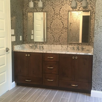 Trendy gray master bathroom with classic elements