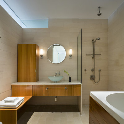 Bathroom - modern stone tile bathroom idea in New York with a vessel sink