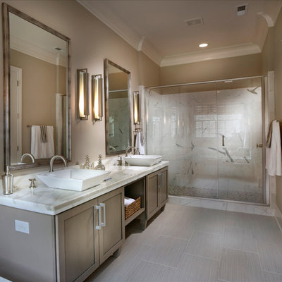 Large elegant master gray tile and ceramic tile ceramic tile alcove shower photo in Charlotte with a vessel sink, gray cabinets, granite countertops, a two-piece toilet, beige walls and shaker cabinets