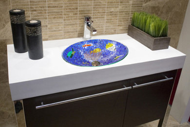 Mid-sized beach style 3/4 multicolored tile and glass tile marble floor bathroom photo in New York with an undermount sink, flat-panel cabinets, dark wood cabinets, marble countertops and beige walls