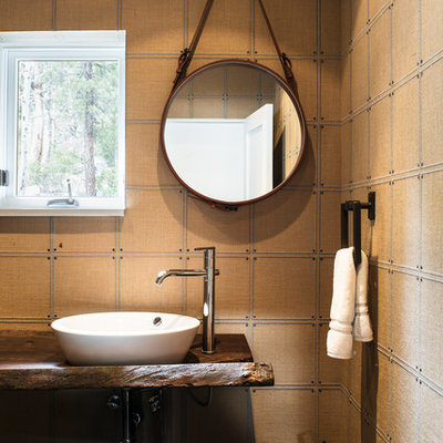 Small eclectic 3/4 bathroom photo in Sacramento with open cabinets, brown cabinets, brown walls and wood countertops