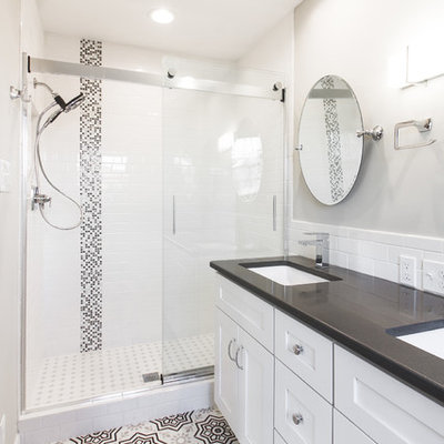 Small country master white tile and subway tile ceramic tile and gray floor bathroom photo in Other with shaker cabinets, white cabinets, a two-piece toilet, gray walls, an undermount sink, quartz countertops and gray countertops