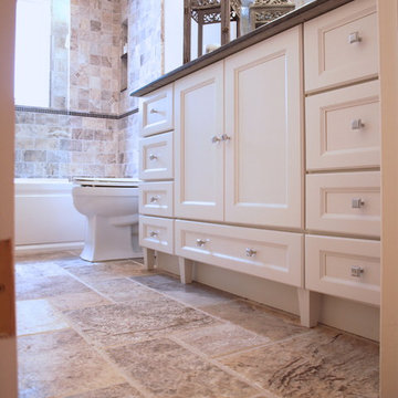 Tumbled Marble Floor Tile and White Vanity