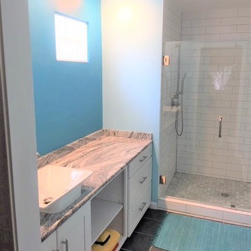 Turquoise  Remodel Guest Bath with black & white granite