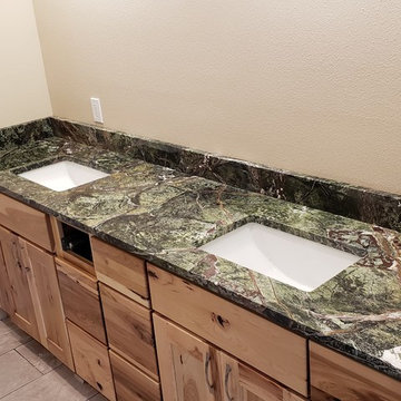 Two Green Rainforest Marble Bathrooms