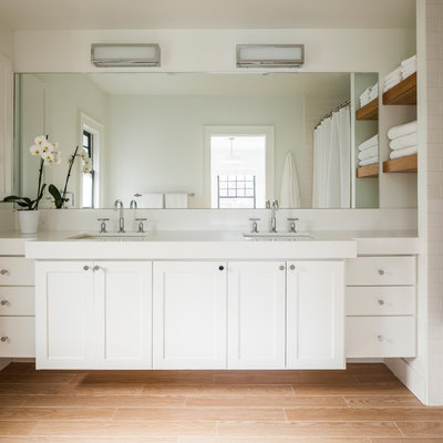 Example of a mid-sized transitional master white tile and ceramic tile light wood floor and beige floor alcove bathtub design in Seattle with shaker cabinets, white cabinets, white walls and an undermount sink
