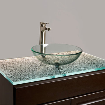 Ultra-clear cast glass countertop for a bathroom vanity with a glass vessel sink