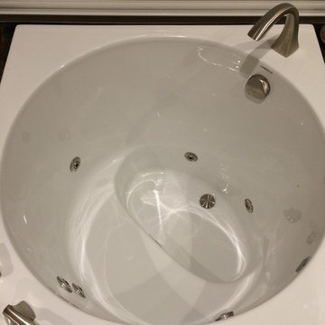 Unique Japanese style tub provides luxury features in a small footprint