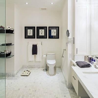 Bathroom - large transitional master white tile and cement tile ceramic tile bathroom idea in Toronto with an undermount sink, white cabinets, a one-piece toilet, white walls, recessed-panel cabinets, marble countertops and white countertops