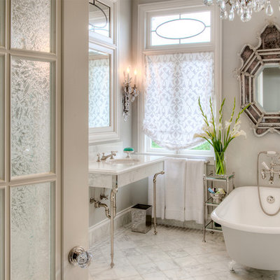 Claw-foot bathtub - traditional white tile claw-foot bathtub idea in San Francisco with a console sink