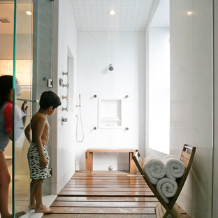Inspiration for a mid-sized contemporary 3/4 medium tone wood floor doorless shower remodel in New York with a hinged shower door and white walls