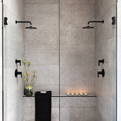 Double shower - large contemporary master gray tile and cement tile gray floor and concrete floor double shower idea in Other with gray walls, a hinged shower door, flat-panel cabinets, medium tone wood cabinets, a vessel sink, concrete countertops and black countertops