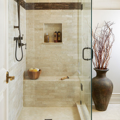Inspiration for a transitional beige tile bathroom remodel in Toronto with a niche