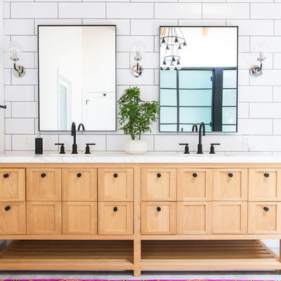 Inspiration for a transitional master white tile and subway tile bathroom remodel in Los Angeles with furniture-like cabinets, light wood cabinets, white walls and white countertops