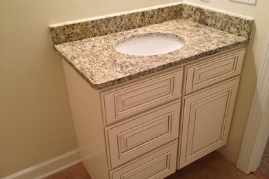 Inspiration for a bathroom remodel in DC Metro with beaded inset cabinets and white cabinets