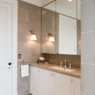 Bathroom - mid-sized traditional master gray tile and stone tile marble floor bathroom idea in Sydney with an undermount sink, recessed-panel cabinets, white cabinets, marble countertops, gray walls and brown countertops
