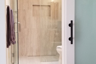 Minimalist 3/4 white tile and porcelain tile porcelain tile and white floor walk-in shower photo in Los Angeles with a hinged shower door