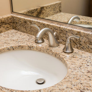 Elegant bathroom photo in Other with granite countertops