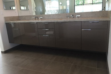 Medium sized ensuite bathroom in Santa Barbara with flat-panel cabinets, grey cabinets and engineered stone worktops.