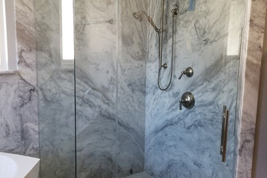 Mid-sized trendy 3/4 gray tile, white tile and marble tile marble floor and gray floor bathroom photo in Dallas with a hinged shower door and gray walls