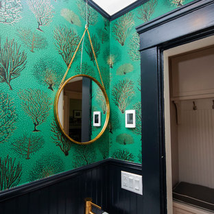Design ideas for a small victorian 3/4 bathroom in Providence with a two-piece toilet, green walls, porcelain floors, a wall-mount sink and black floor.