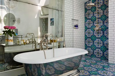 This is an example of a large victorian bathroom in Austin with a freestanding bath, an alcove shower, multi-coloured tiles, cement tiles, white walls and mosaic tile flooring.