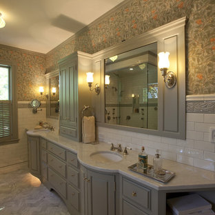 Traditional bathroom in Boston with marble benchtops.