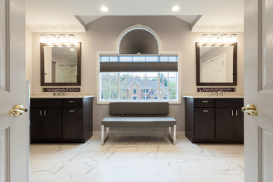Example of a large trendy master white tile and porcelain tile porcelain tile and white floor double shower design in DC Metro with flat-panel cabinets, dark wood cabinets, a one-piece toilet, gray walls, an undermount sink, quartz countertops, a hinged shower door and white countertops