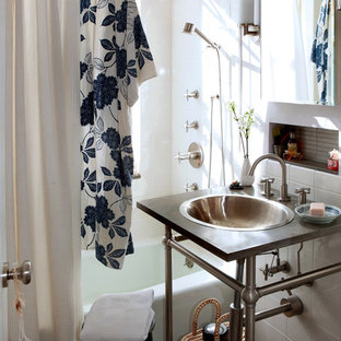 Inspiration for an eclectic bathroom remodel in New York with limestone countertops and a drop-in sink