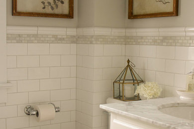 Bathroom - small traditional master white tile and subway tile porcelain tile bathroom idea in Ottawa with an undermount sink, shaker cabinets, white cabinets, marble countertops, a one-piece toilet and gray walls