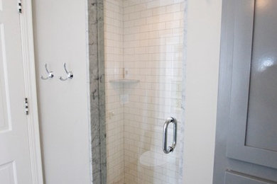 Example of a small ornate 3/4 white tile and subway tile mosaic tile floor alcove shower design in Other with an undermount sink, shaker cabinets, gray cabinets, marble countertops, a one-piece toilet and gray walls