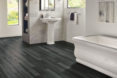 Inspiration for a large transitional master gray tile and porcelain tile vinyl floor and gray floor freestanding bathtub remodel in Other with gray walls and a pedestal sink