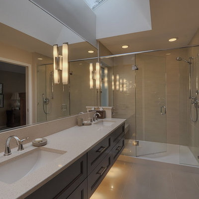 Bathroom - contemporary bathroom idea in Vancouver with solid surface countertops and an undermount sink